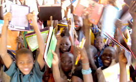 Kids with books in Damana school